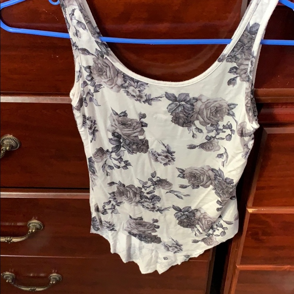 White tank with grayish black flowers